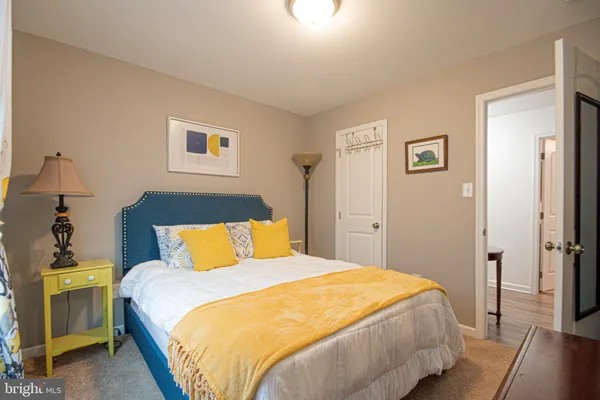 a bedroom with bed and a fireplace