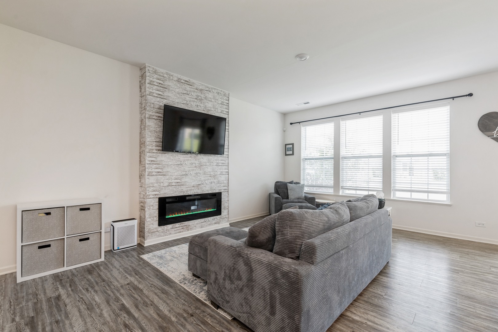 1226 Draper Road McHenry, IL 60050 - Photo 3 of 12 a living room with furniture a fireplace and a flat screen tv