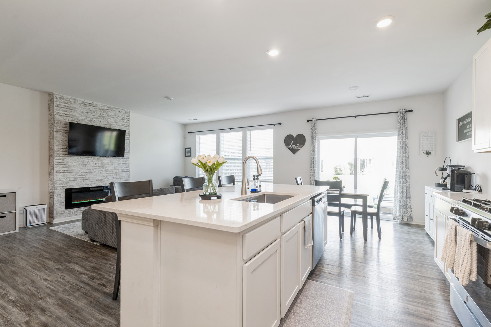 1226 Draper Road McHenry, IL 60050 - Photo 5 of 12 a open kitchen with sink cabinets and a wooden floor