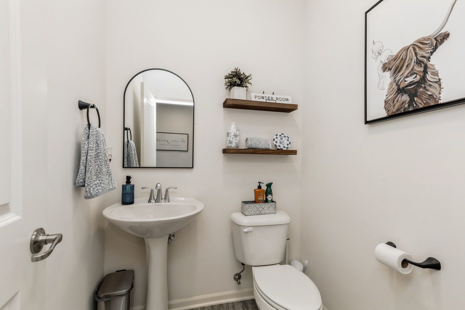 1226 Draper Road McHenry, IL 60050 - Photo 6 of 12 a bathroom with a toilet sink and mirror