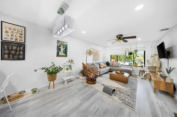 a living room with furniture or couch and a flat screen tv