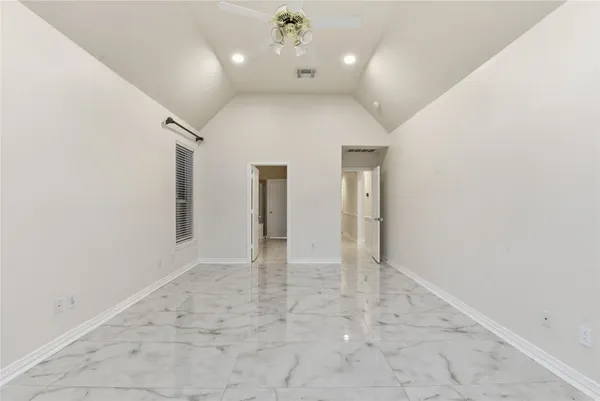 a bathroom with a tub and shower