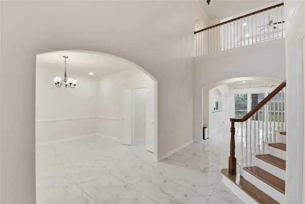 a view of a hallway with staircase