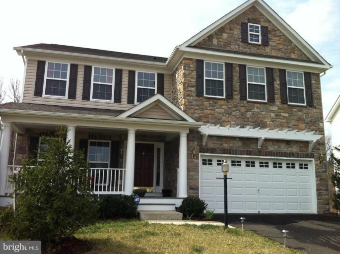 4279 Meyers Road Triangle, VA 22172 - Photo 1 of 24 a front view of a house with a yard