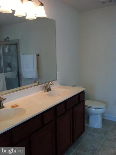 4279 Meyers Road Triangle, VA 22172 - Photo 22 of 24 a bathroom with a sink and a toilet