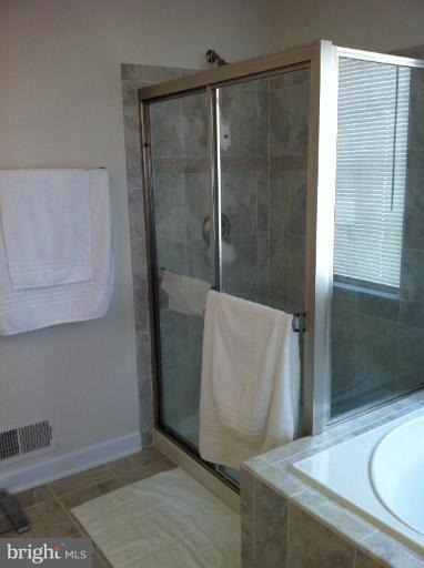 4279 Meyers Road Triangle, VA 22172 - Photo 23 of 24 a bathroom with a shower and a sink