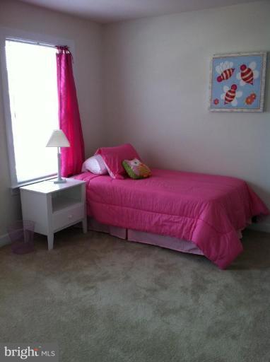 4279 Meyers Road Triangle, VA 22172 - Photo 10 of 24 a bedroom with a bed and a window