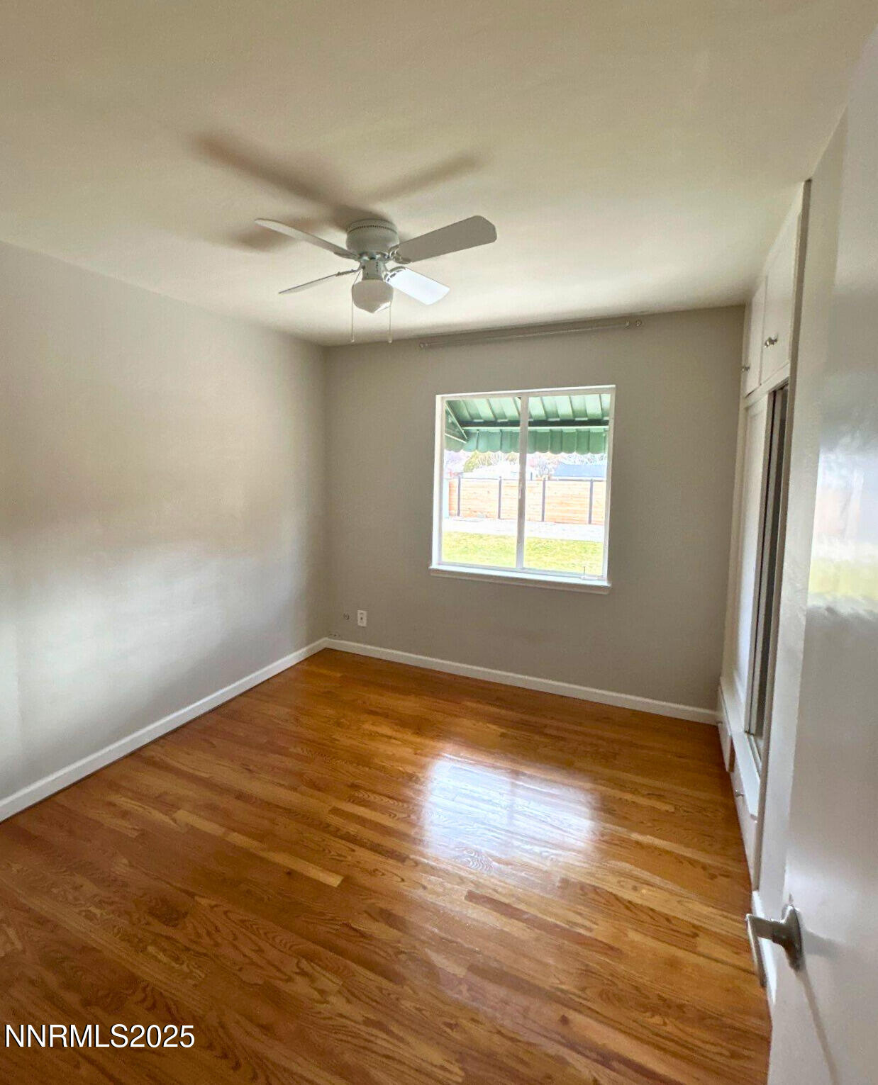 320 West Plumb Lane Reno, NV 89509 - Photo 11 of 22 an empty room with wooden floor and windows