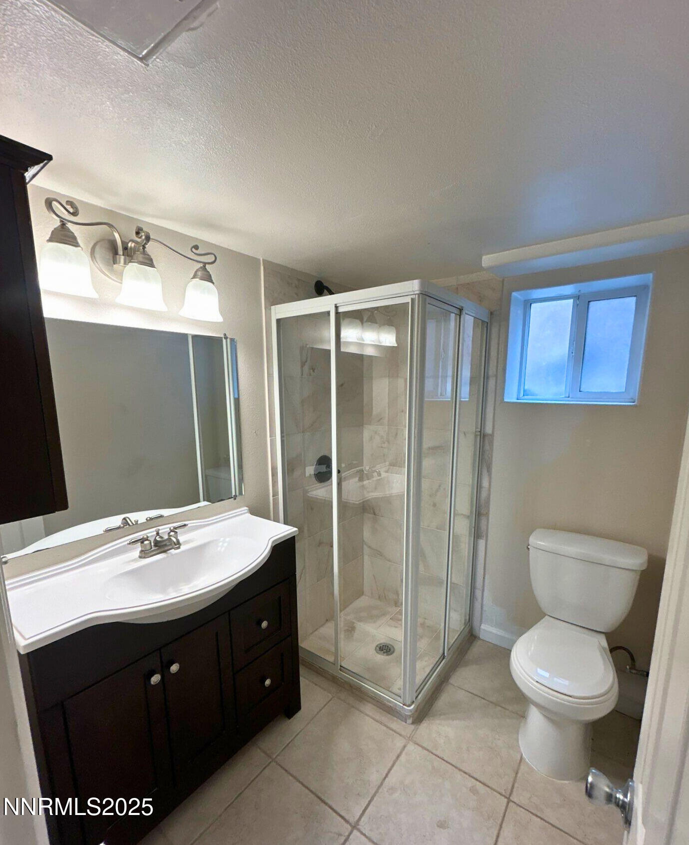 320 West Plumb Lane Reno, NV 89509 - Photo 9 of 22 a bathroom with a sink toilet and shower