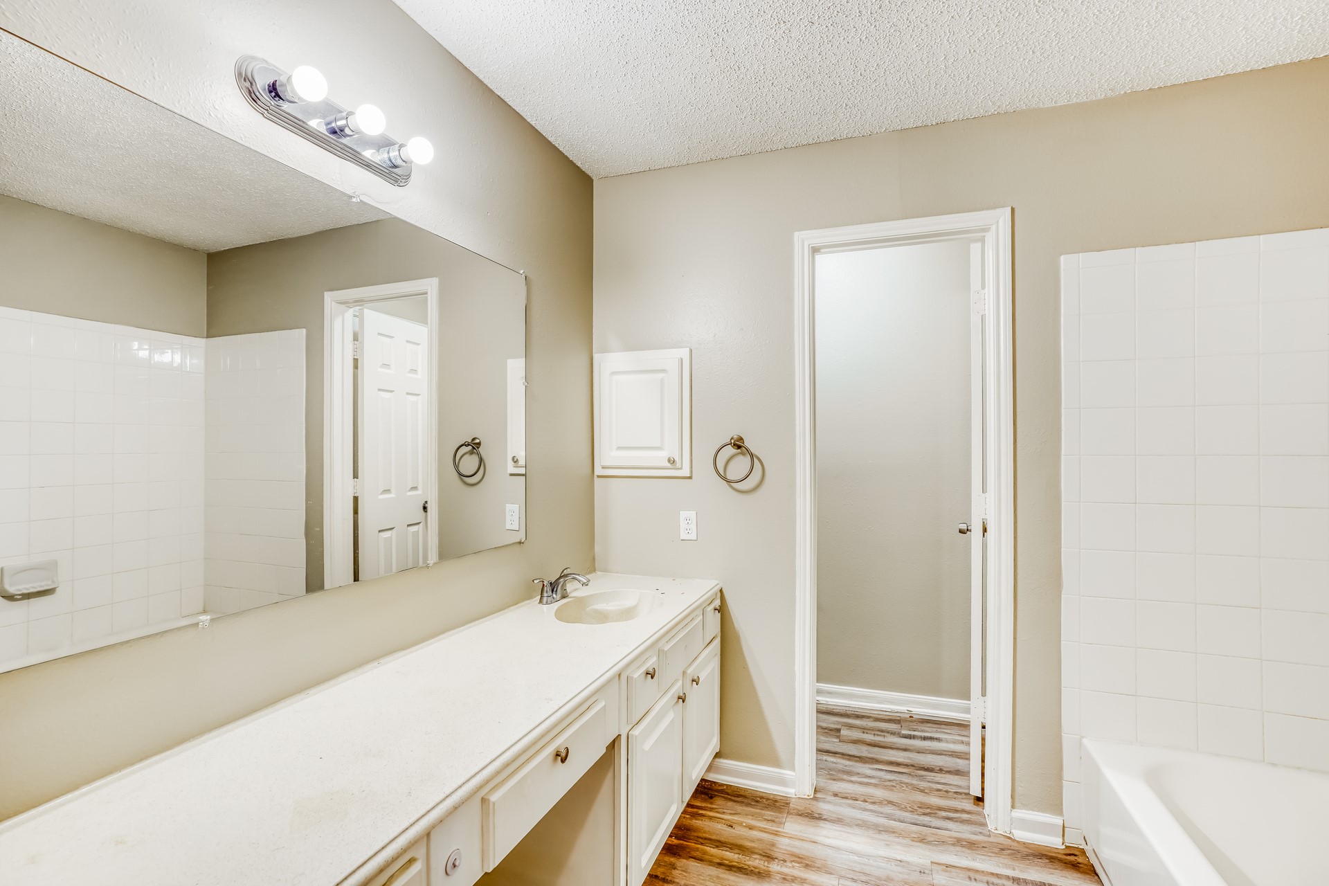 1635 Ridgebriar Drive Houston, TX 77014 - Photo 13 of 21 a spacious bathroom with a double vanity sink a mirror and a shower