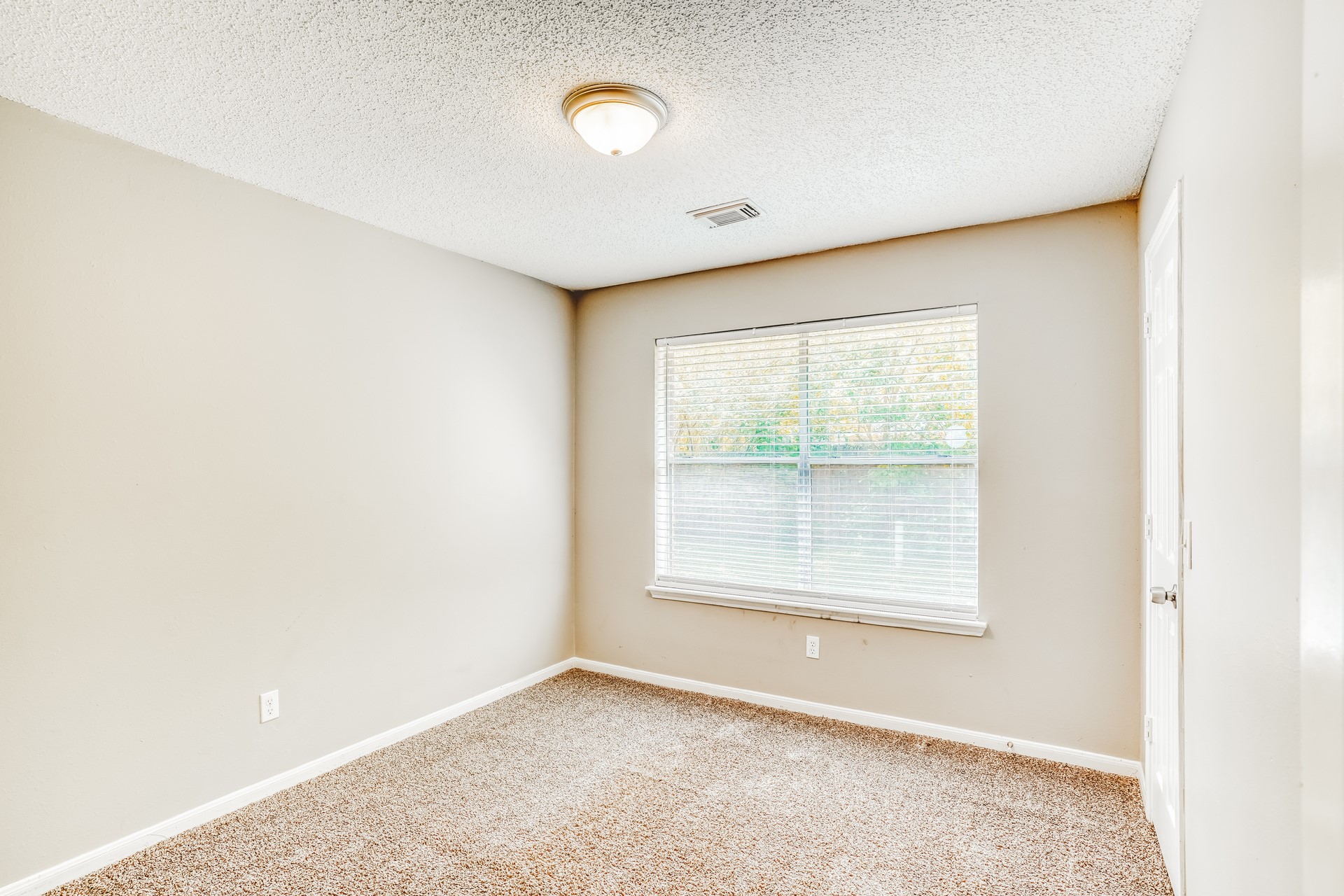 1635 Ridgebriar Drive Houston, TX 77014 - Photo 17 of 21 an empty room with a window