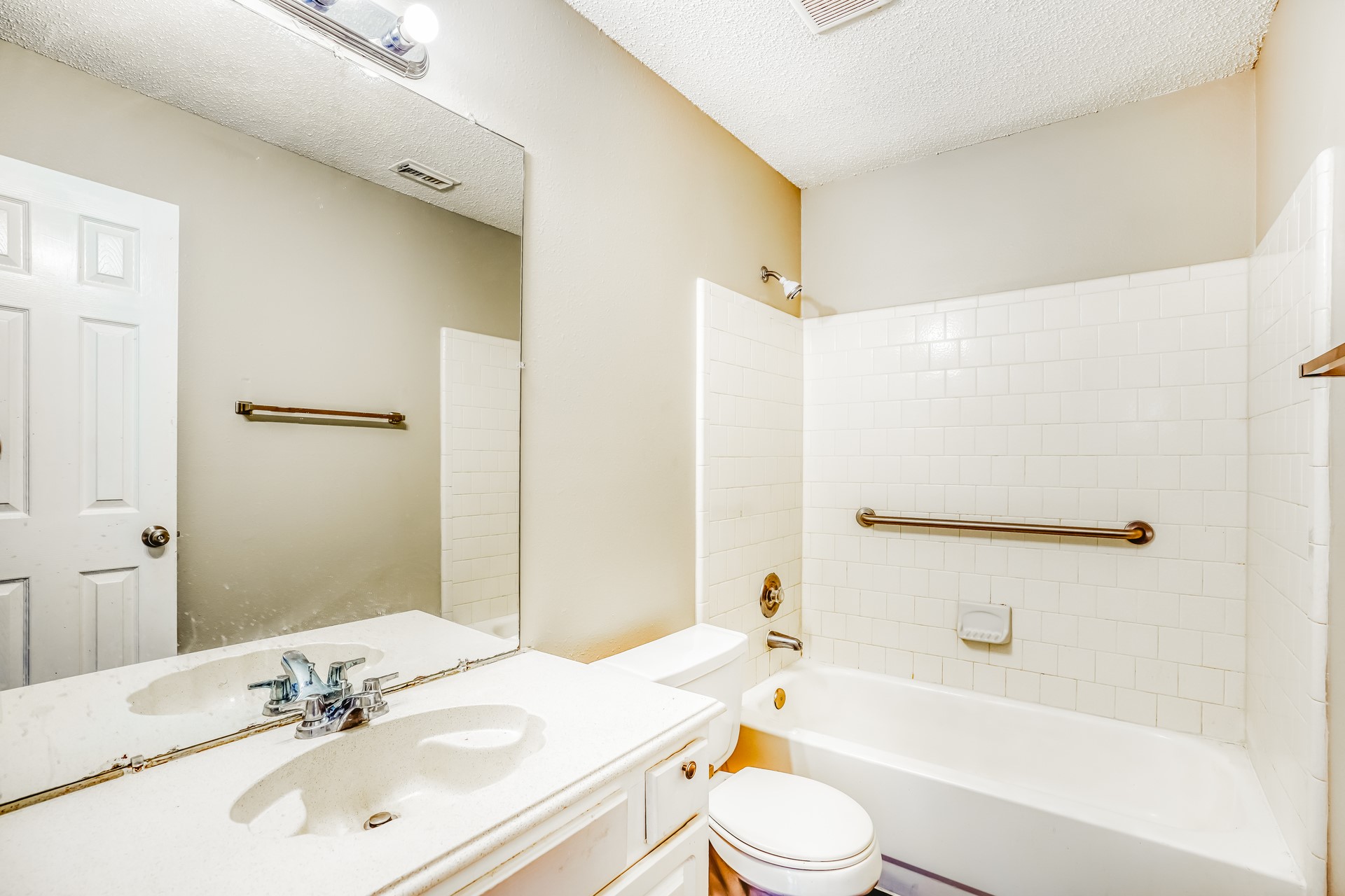 1635 Ridgebriar Drive Houston, TX 77014 - Photo 18 of 21 a bathroom with a bathtub shower sink vanity mirror and toilet