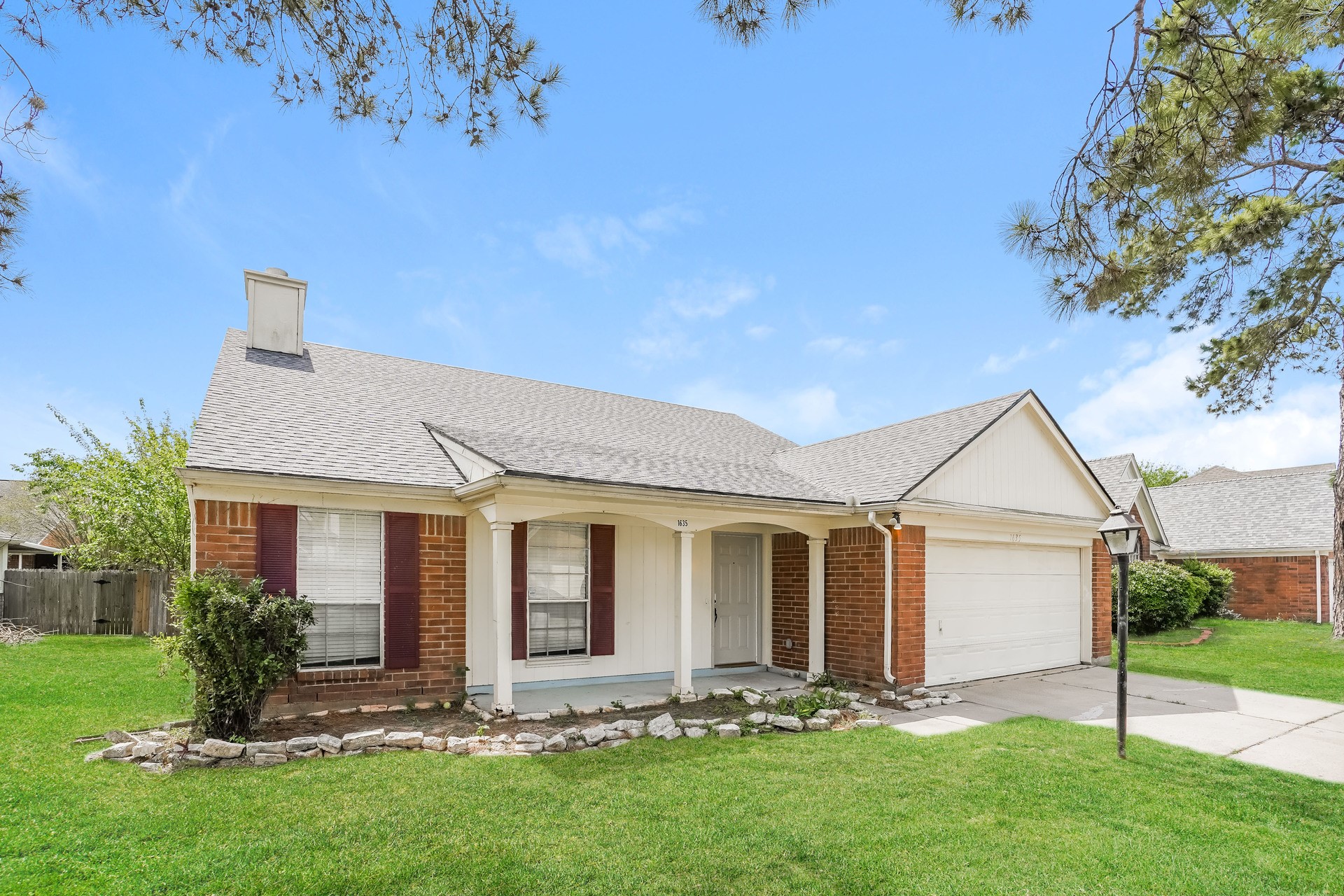 1635 Ridgebriar Drive Houston, TX 77014 - Photo 2 of 21 a front view of a house with a garden and yard