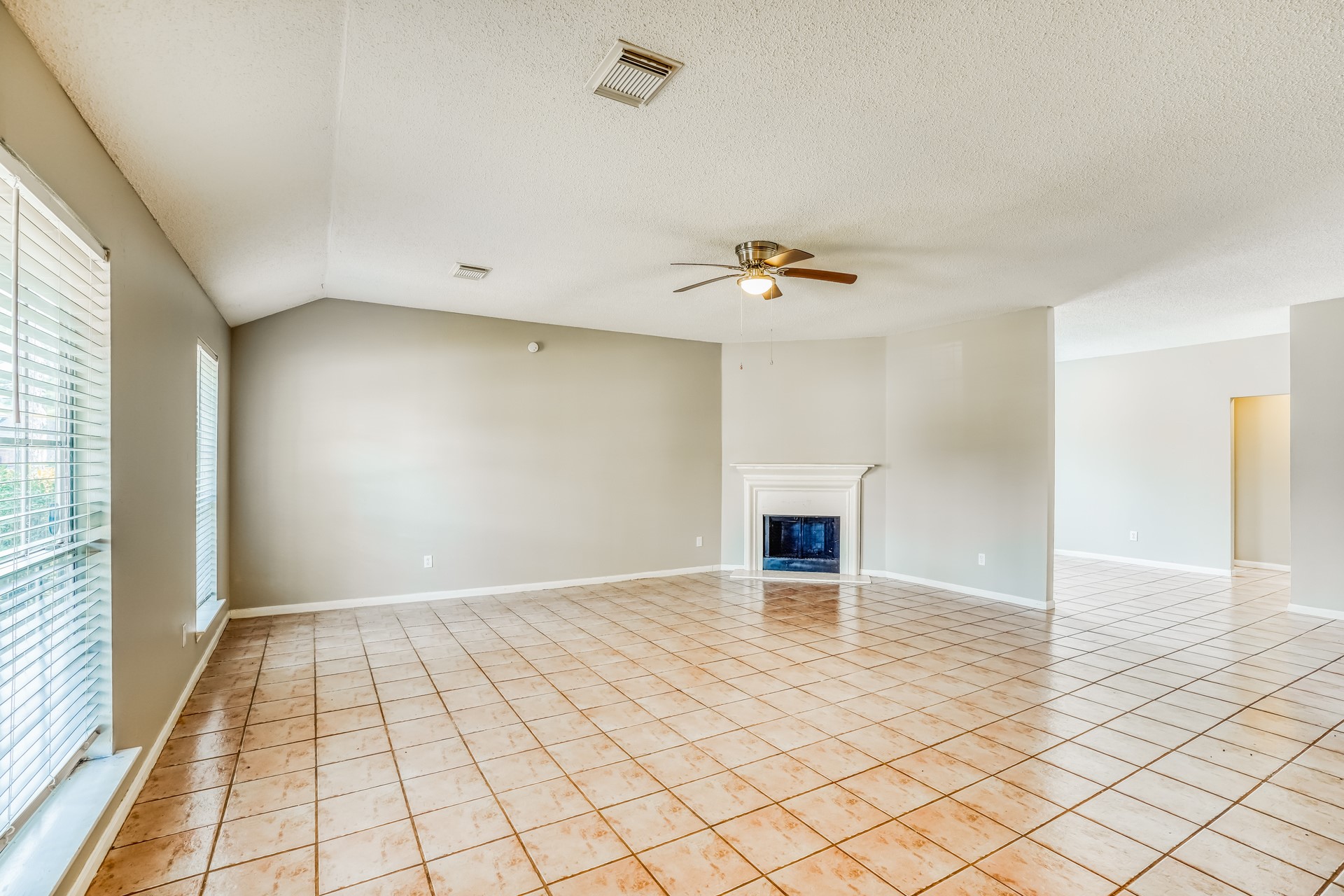 1635 Ridgebriar Drive Houston, TX 77014 - Photo 4 of 21 wooden floor in an empty room with a window