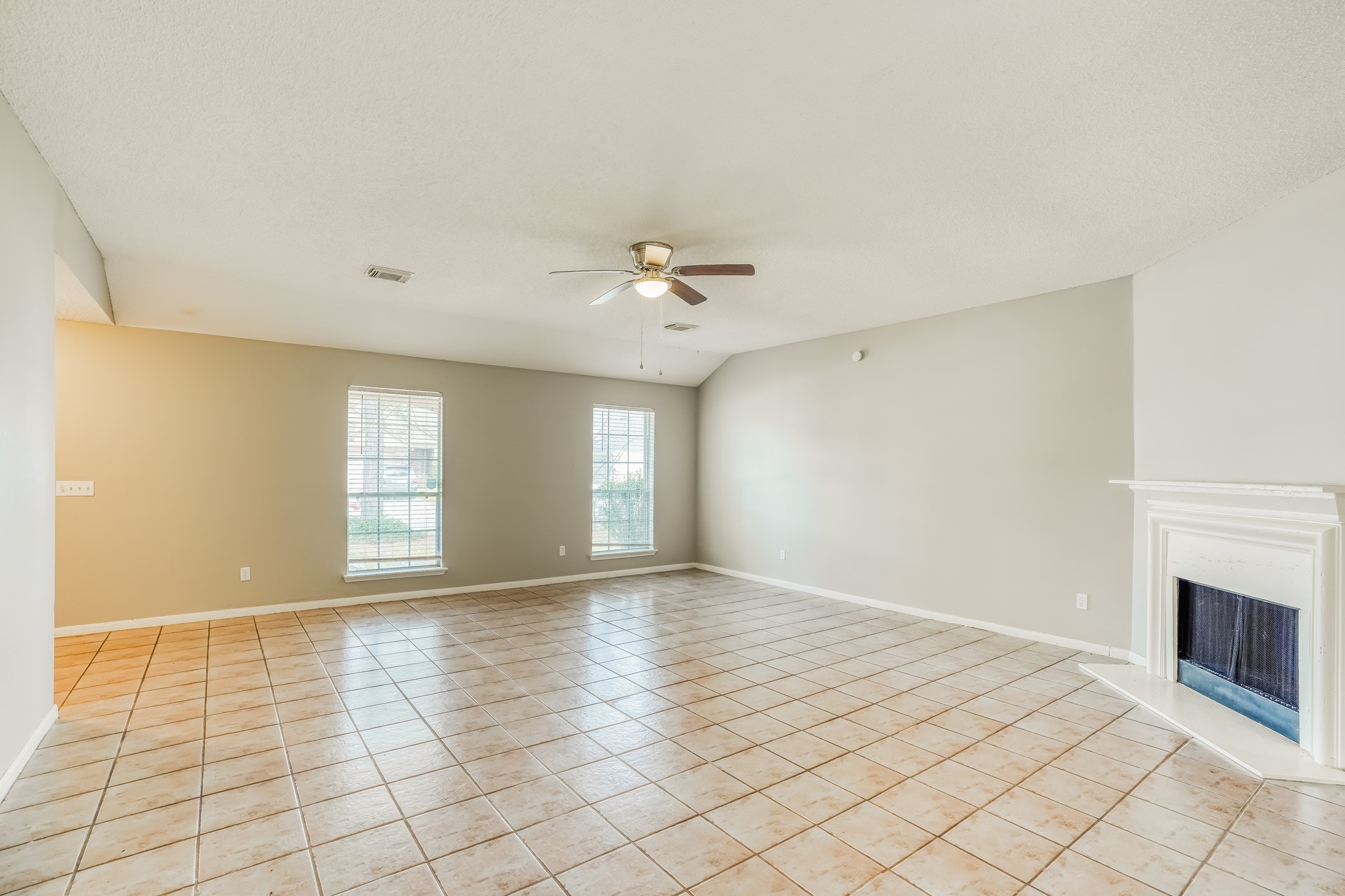 1635 Ridgebriar Drive Houston, TX 77014 - Photo 5 of 21 a view of an empty room with window and chandelier fan