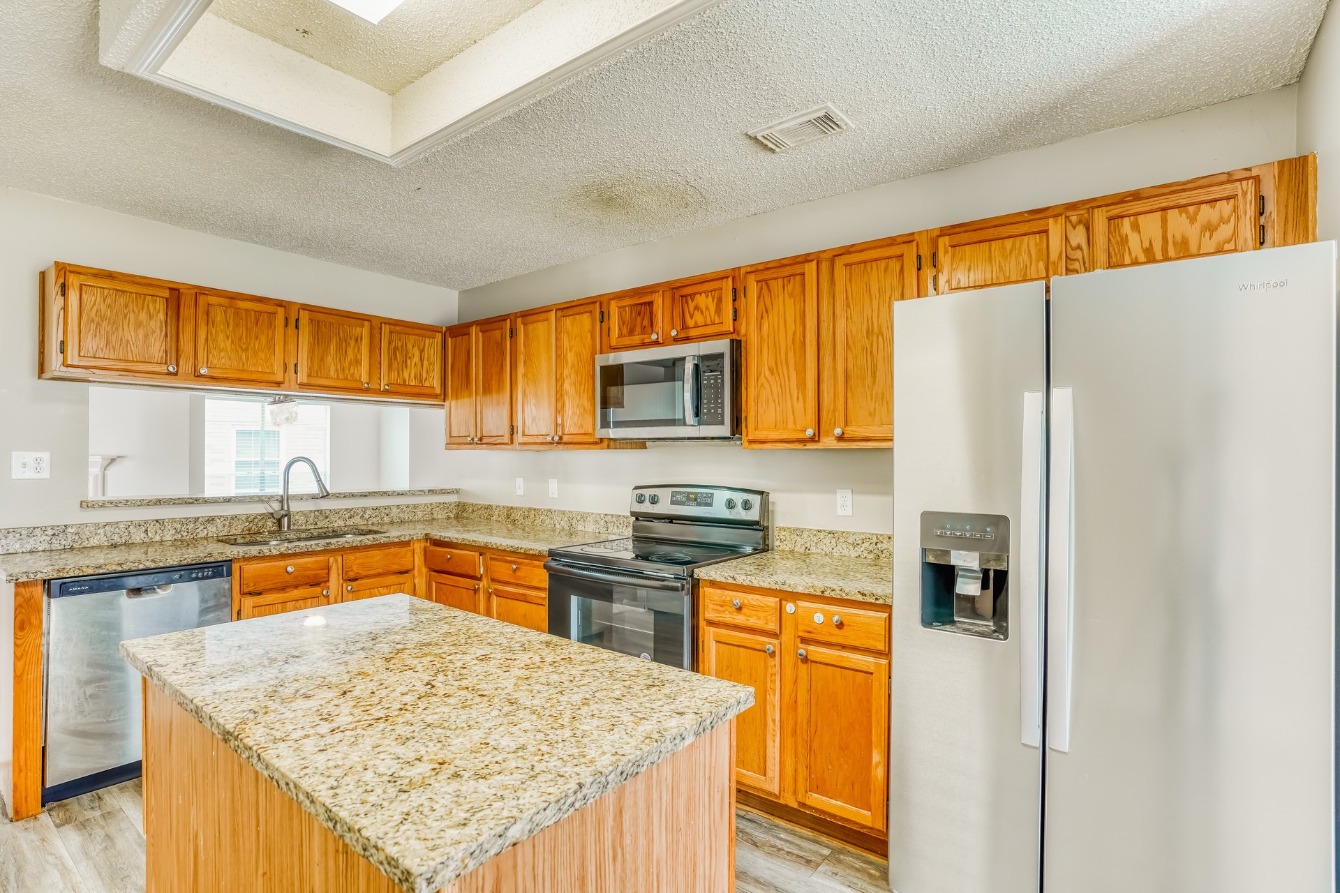 1635 Ridgebriar Drive Houston, TX 77014 - Photo 10 of 21 a kitchen with stainless steel appliances granite countertop a refrigerator a stove top oven a sink and dishwasher