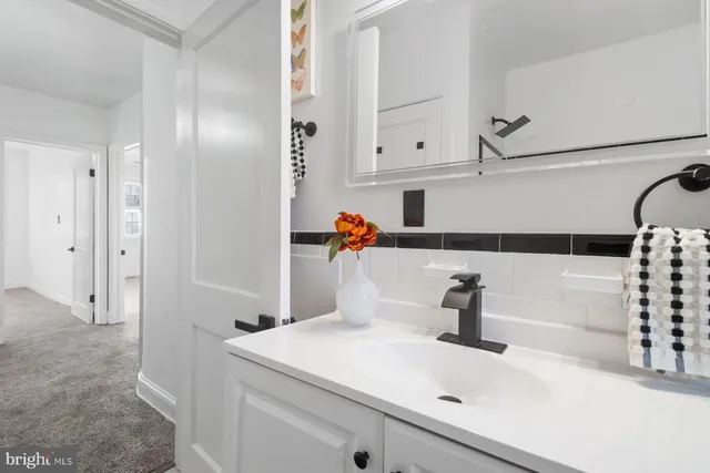 a bathroom with a sink a toilet and tub