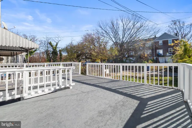 a balcony view with a seating space