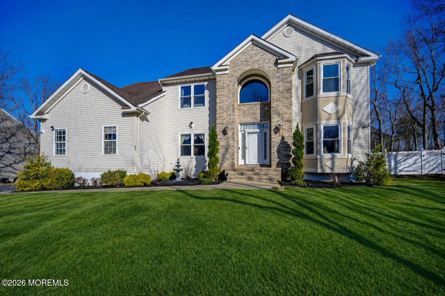 435 Vath Street Jackson, NJ 08527 - Photo 1 of 54 a front view of a house with a garden