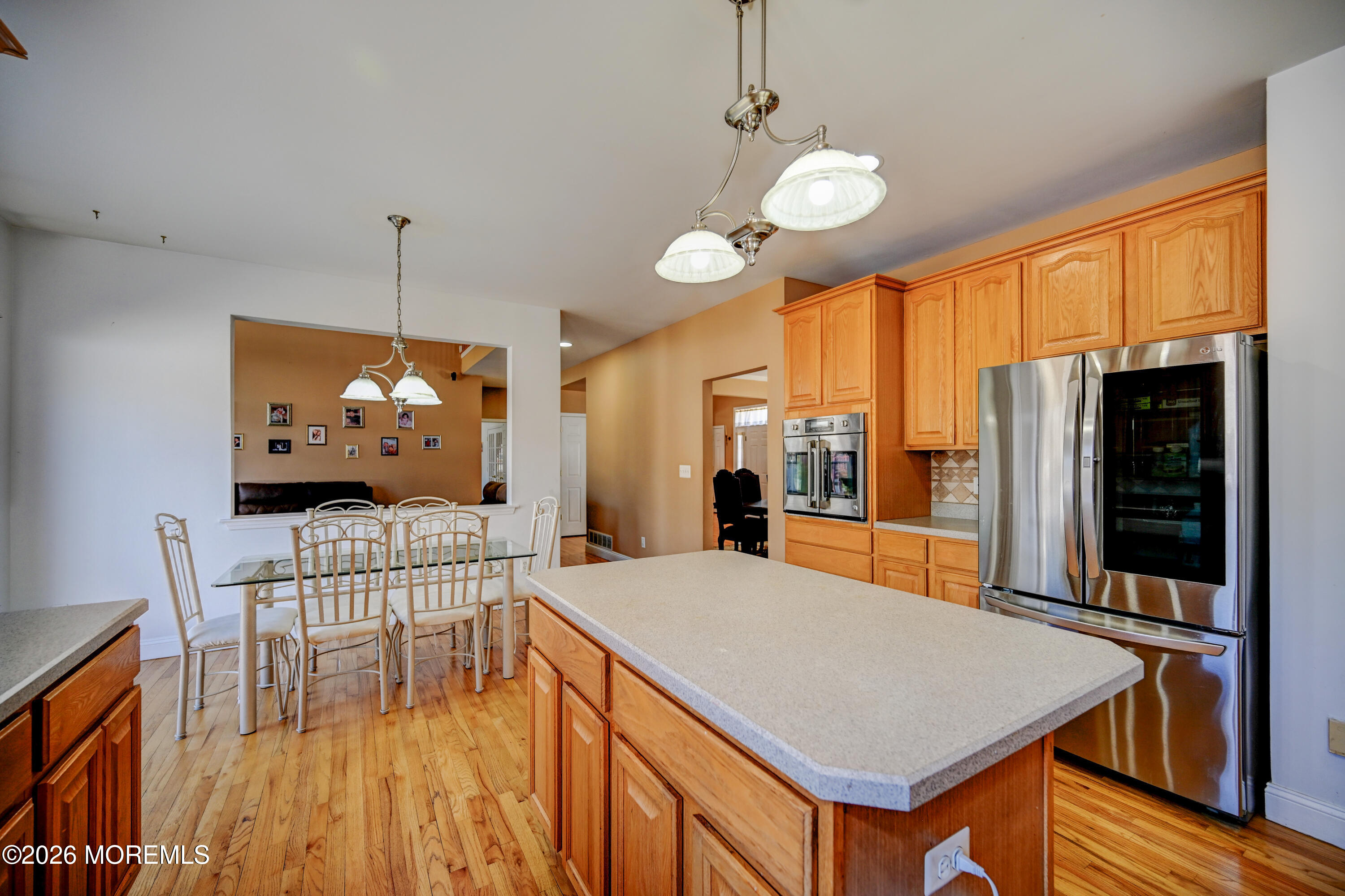 435 Vath Street Jackson, NJ 08527 - Photo 14 of 59 a view of a dining room with furniture a chandelier and wooden floor