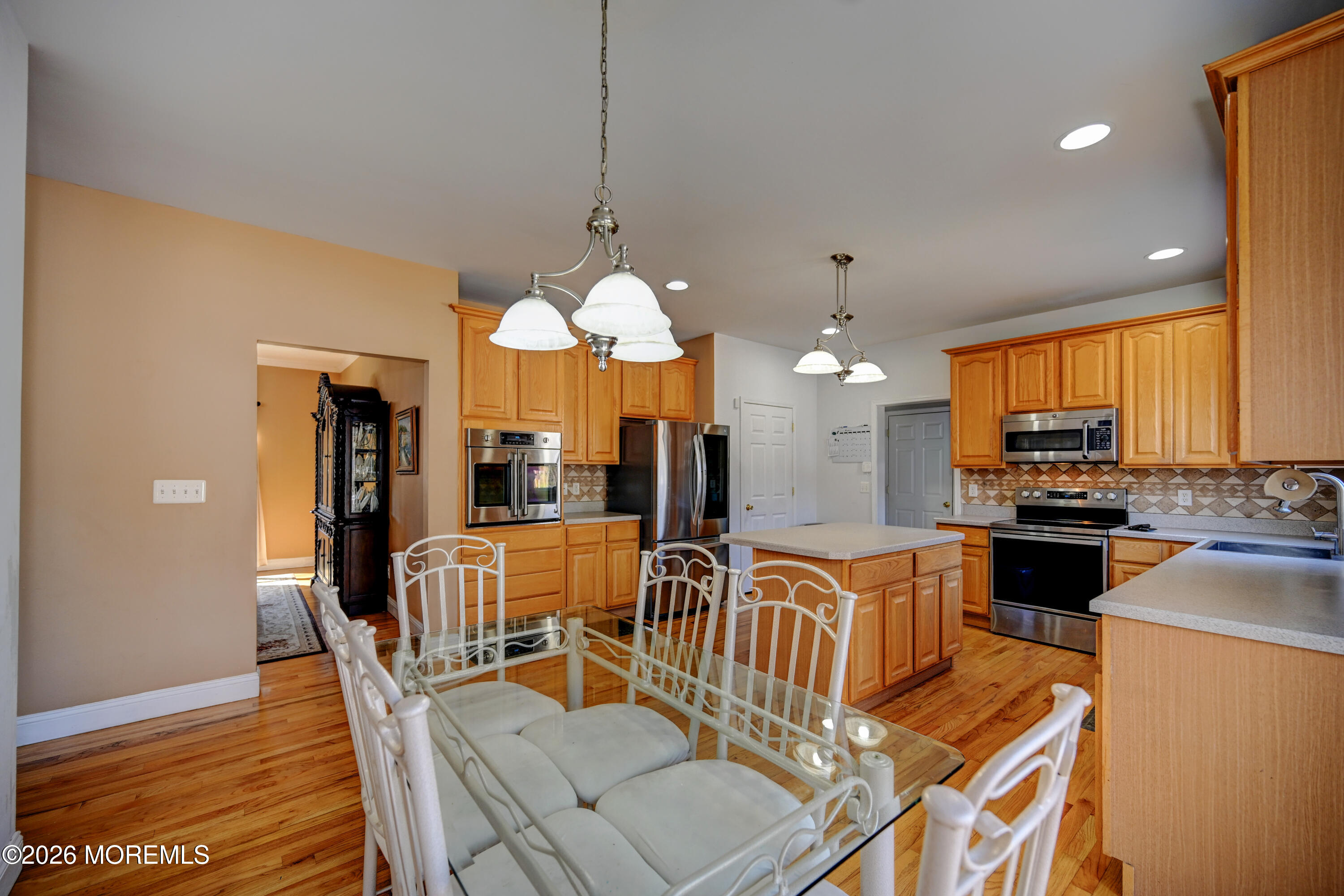435 Vath Street Jackson, NJ 08527 - Photo 16 of 59 a view of a dining room with furniture a chandelier and wooden floor
