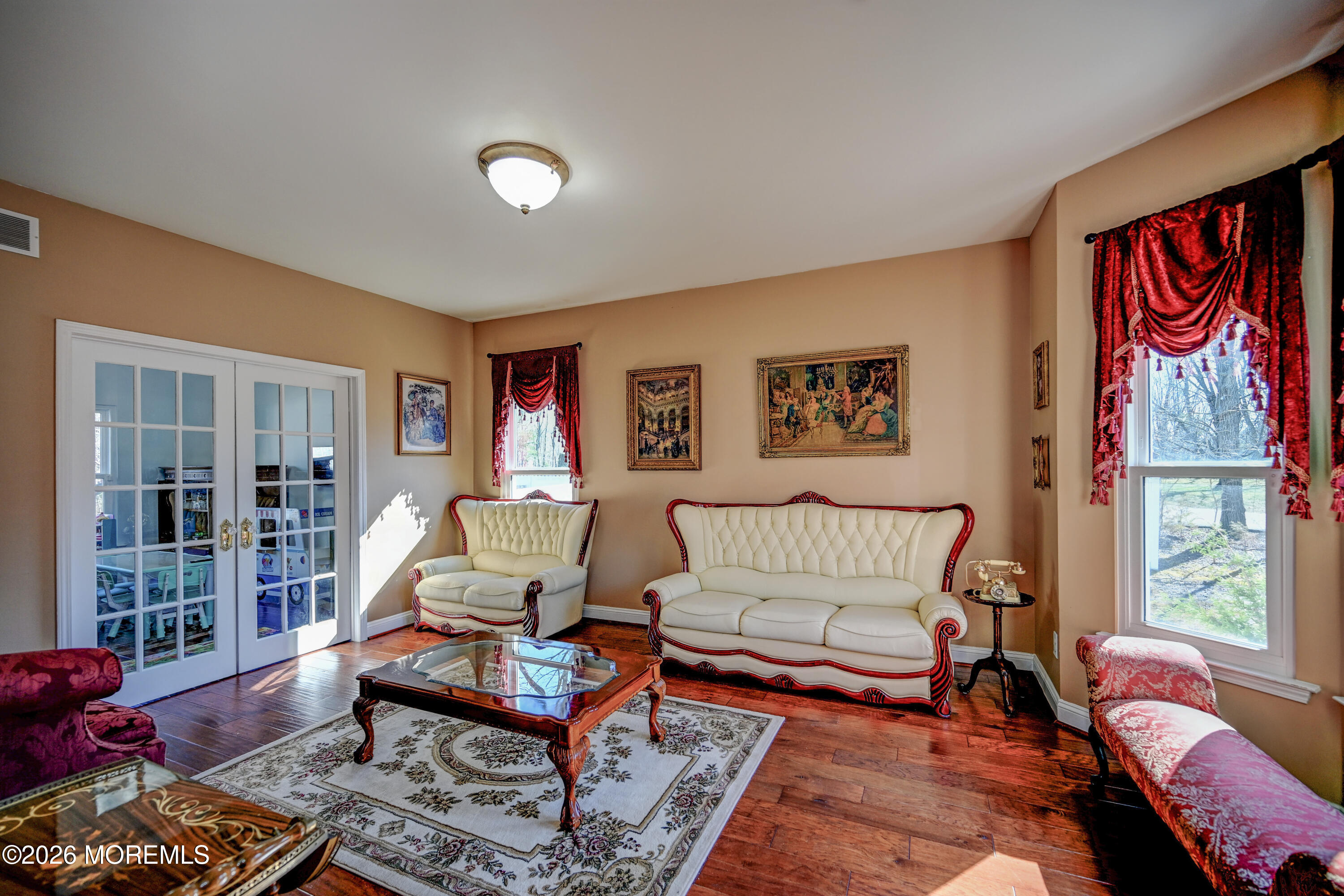 435 Vath Street Jackson, NJ 08527 - Photo 18 of 59 a living room with furniture a rug and a large window