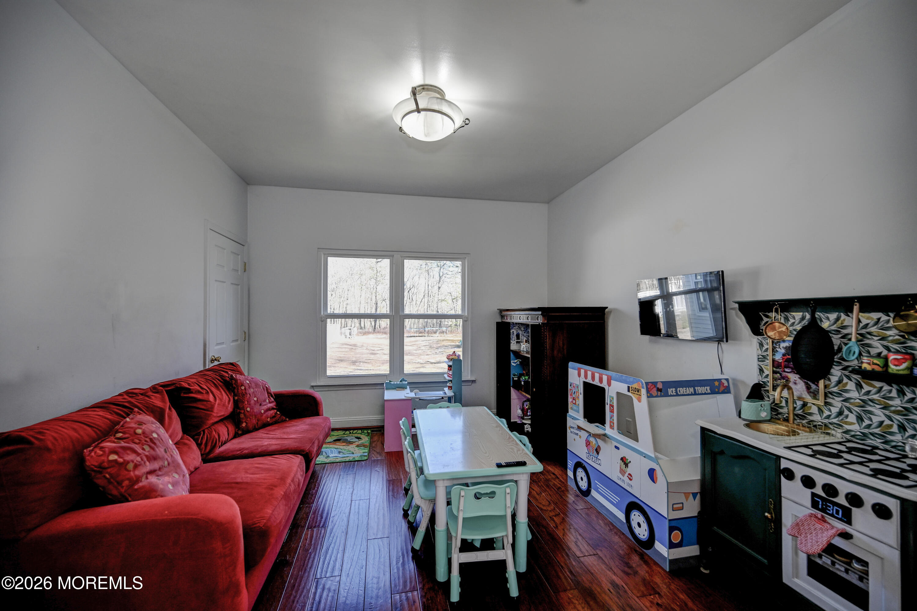 435 Vath Street Jackson, NJ 08527 - Photo 20 of 59 a living room with furniture fireplace and flat screen tv