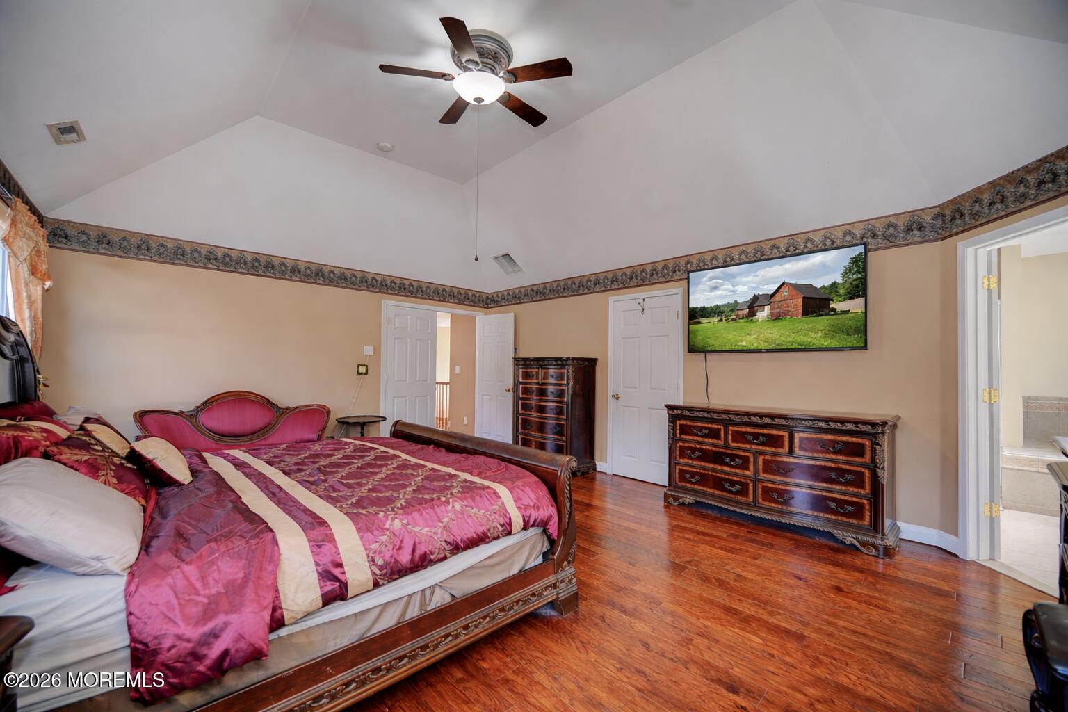 435 Vath Street Jackson, NJ 08527 - Photo 28 of 59 a bedroom with a bed and wooden floor