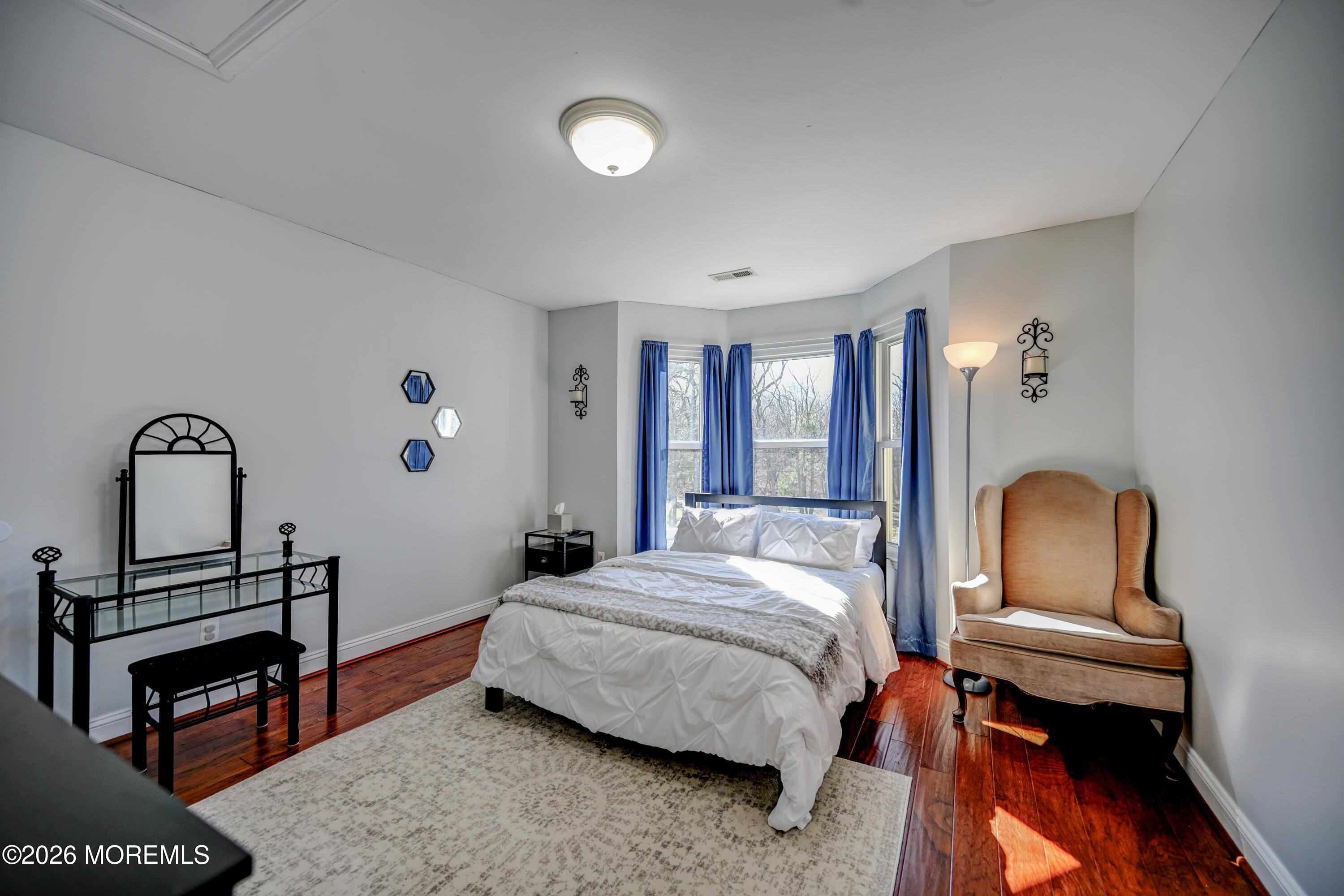 435 Vath Street Jackson, NJ 08527 - Photo 31 of 59 a bedroom with a bed a dresser and potted plants