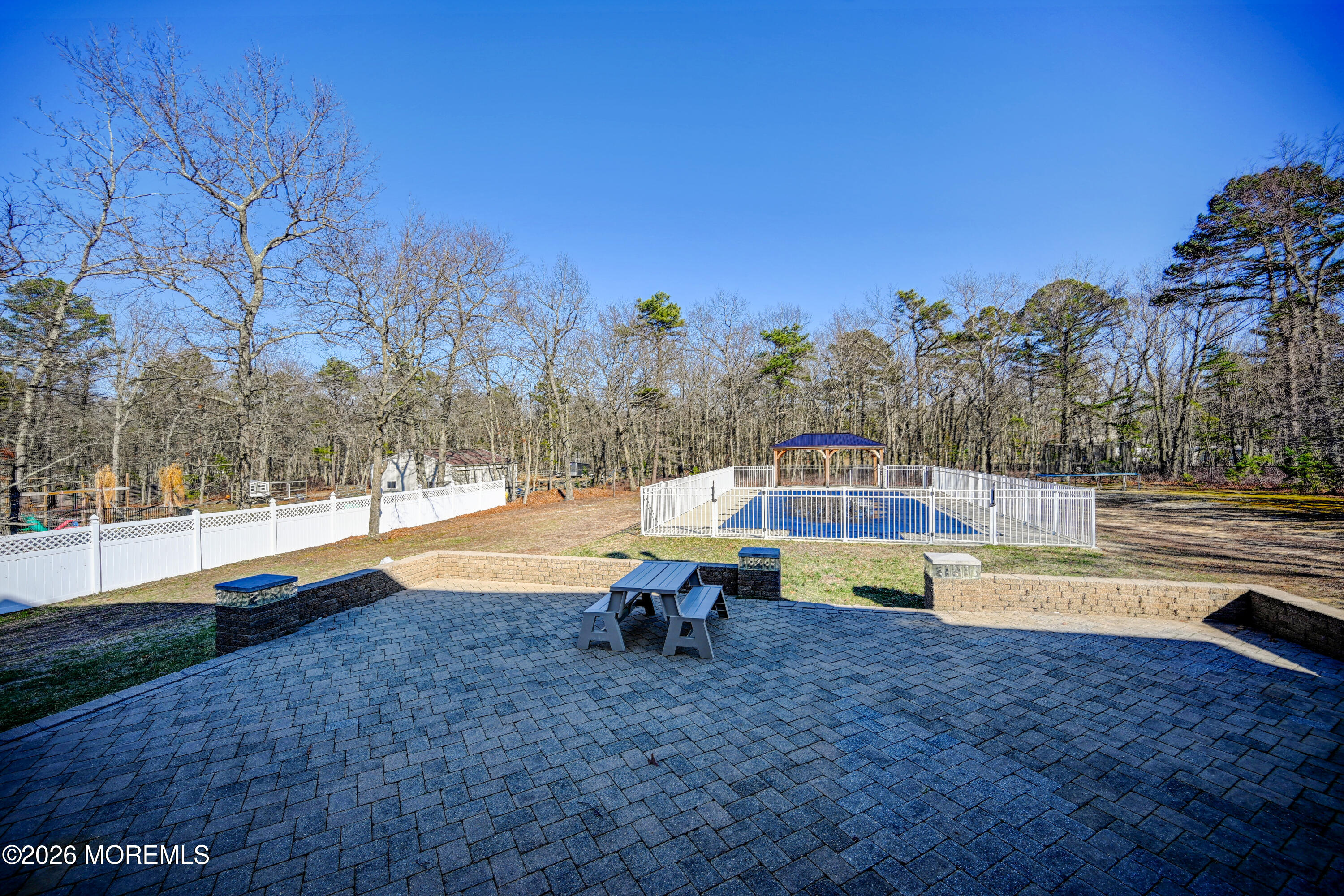 435 Vath Street Jackson, NJ 08527 - Photo 44 of 54 a view of a swimming pool with an outdoor space and seating area