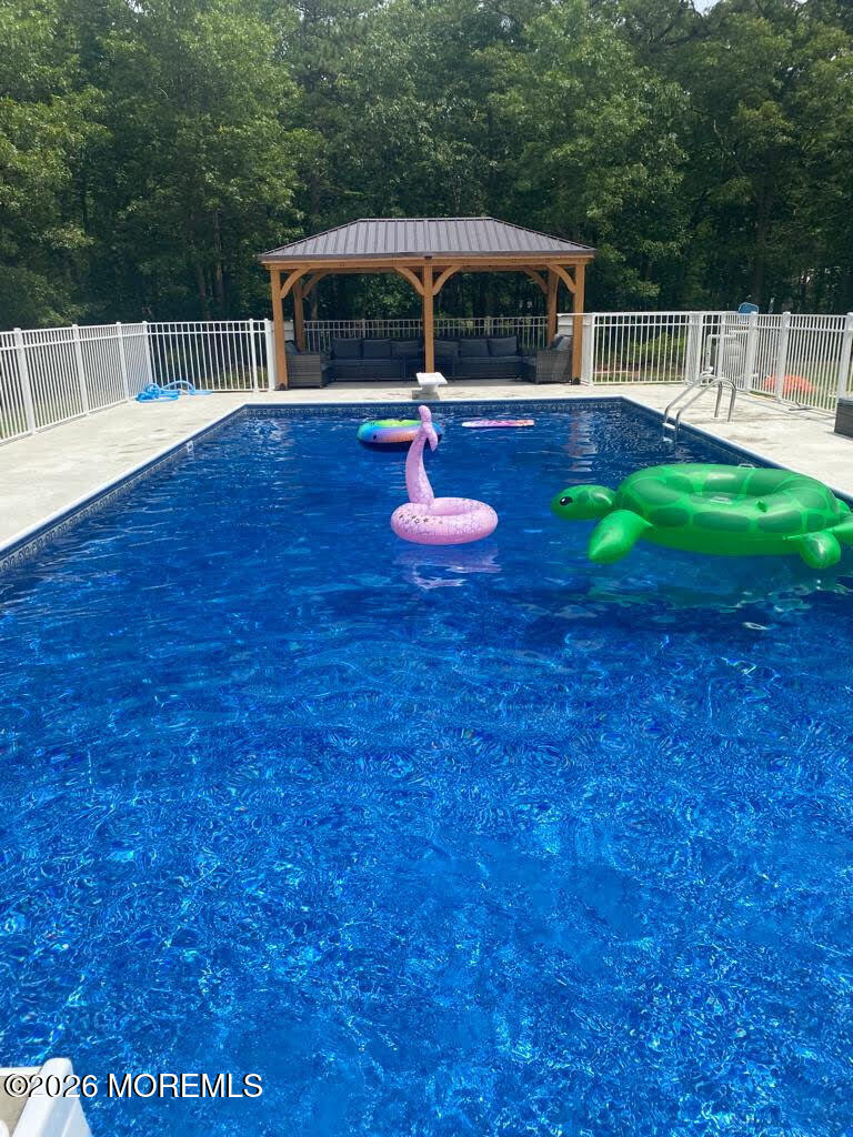 435 Vath Street Jackson, NJ 08527 - Photo 46 of 59 a backyard of a house with table and chairs