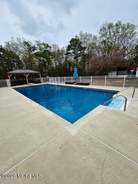 435 Vath Street Jackson, NJ 08527 - Photo 46 of 54 a view of a swimming pool with a chair