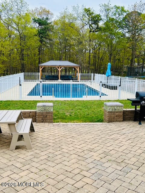 435 Vath Street Jackson, NJ 08527 - Photo 49 of 59 a view of a chair and tables on the patio
