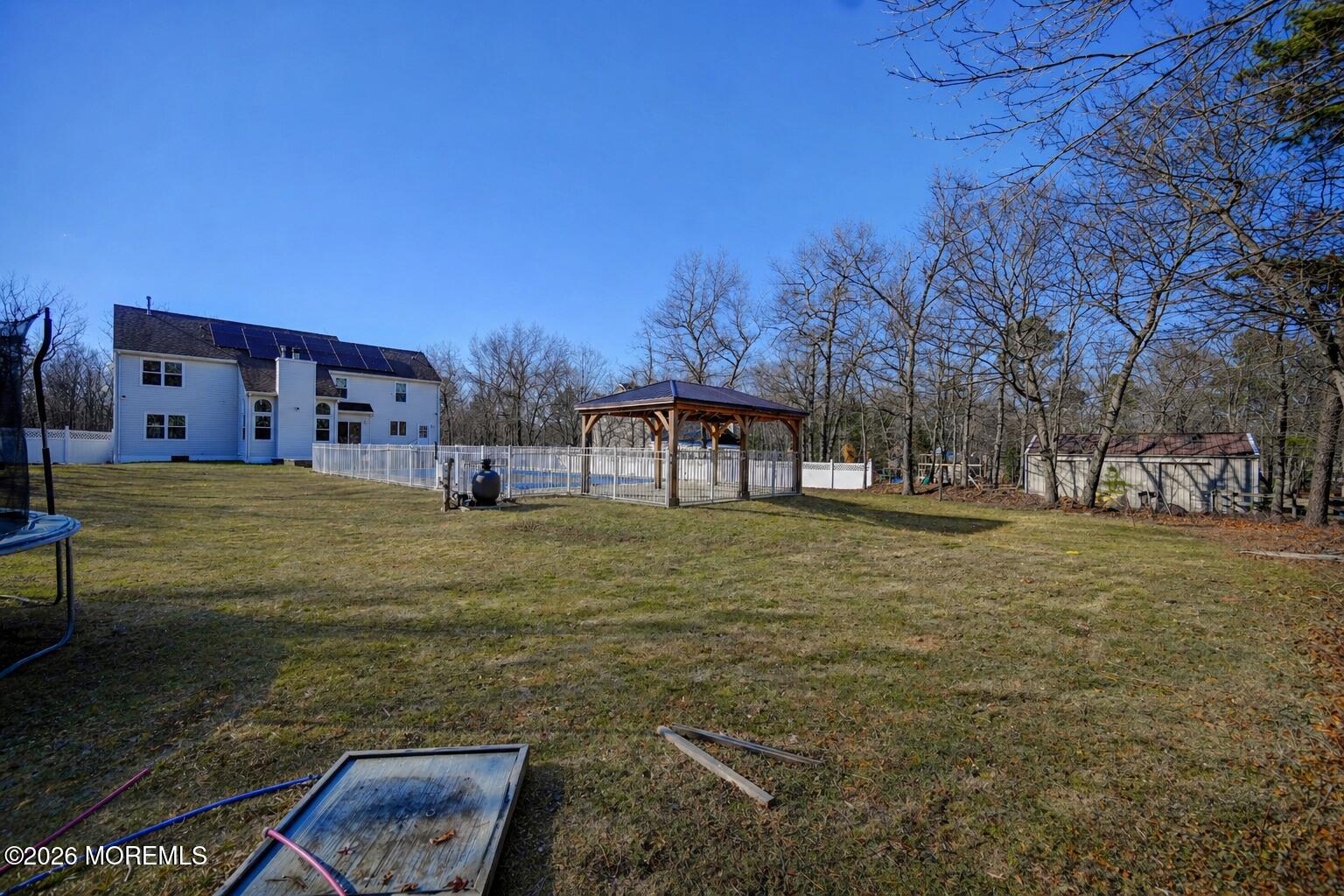 435 Vath Street Jackson, NJ 08527 - Photo 53 of 54 a view of a garden with a bench