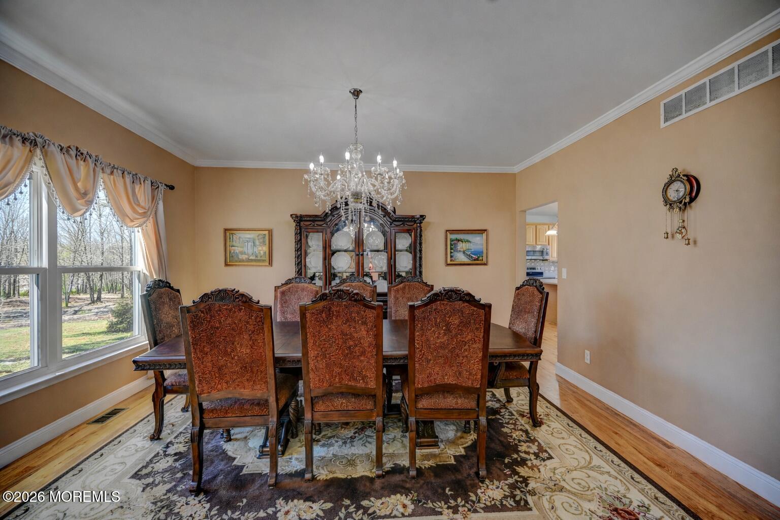 435 Vath Street Jackson, NJ 08527 - Photo 6 of 59 a view of a dining room with furniture a chandelier and wooden floor