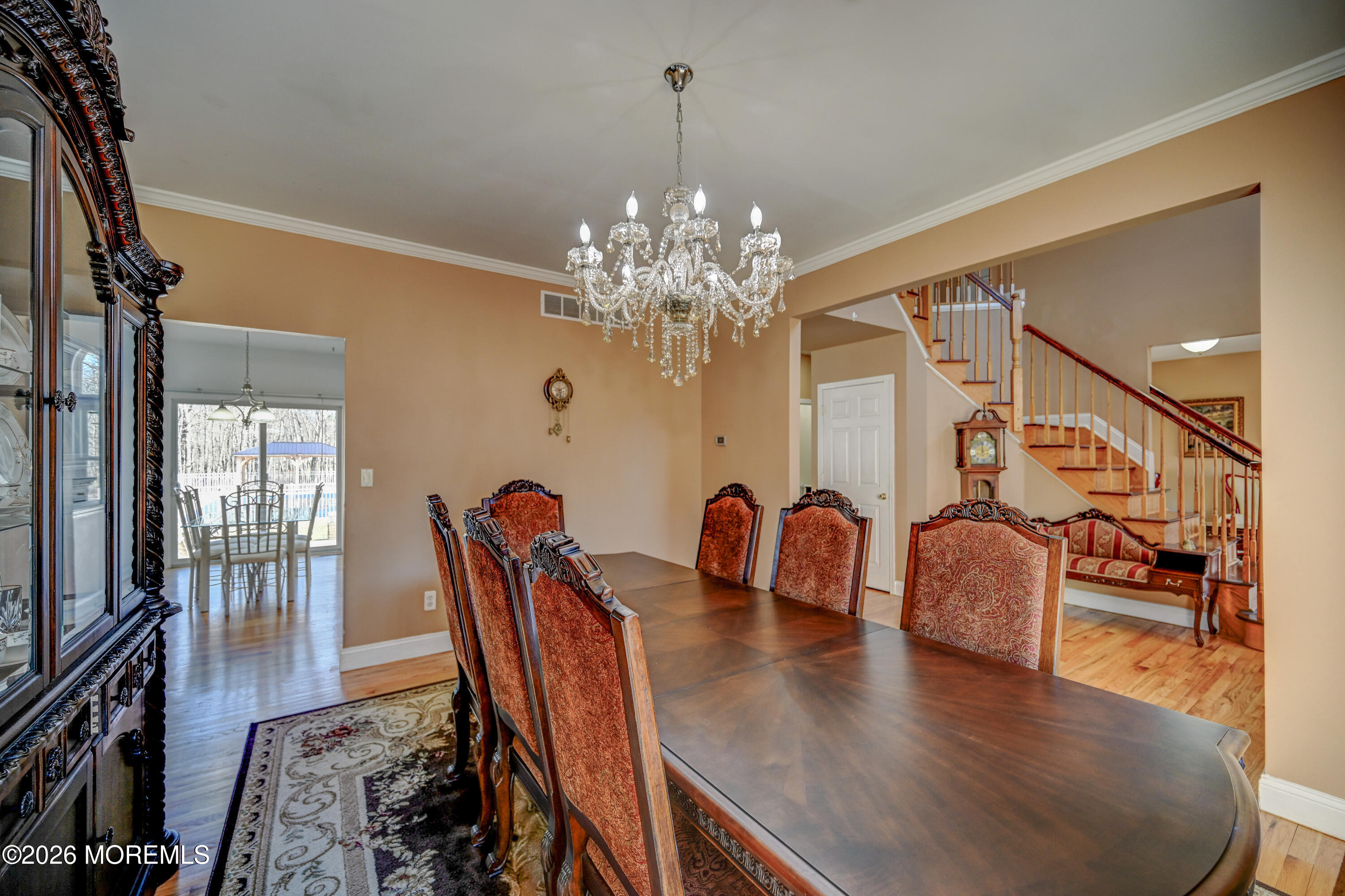 435 Vath Street Jackson, NJ 08527 - Photo 8 of 59 a dining room with furniture a chandelier and wooden floor