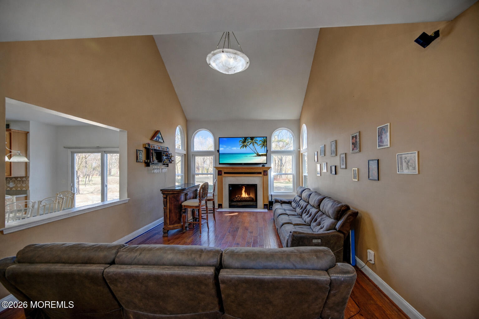 435 Vath Street Jackson, NJ 08527 - Photo 9 of 59 a living room with furniture a fireplace and a large window