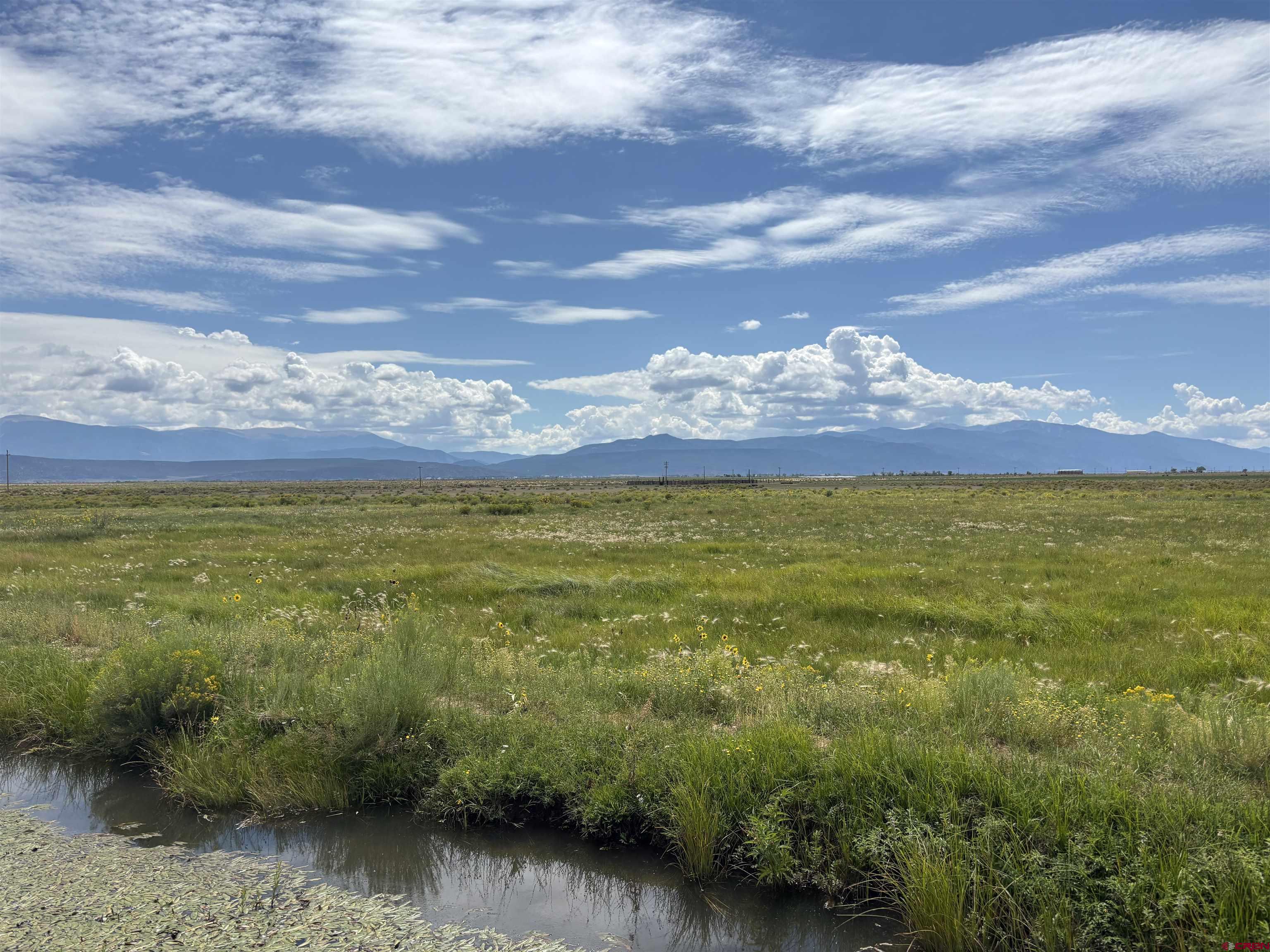 9227 County Rd C Jaroso, CO 81138 - Photo 15 of 28 a view of a lake with a mountain