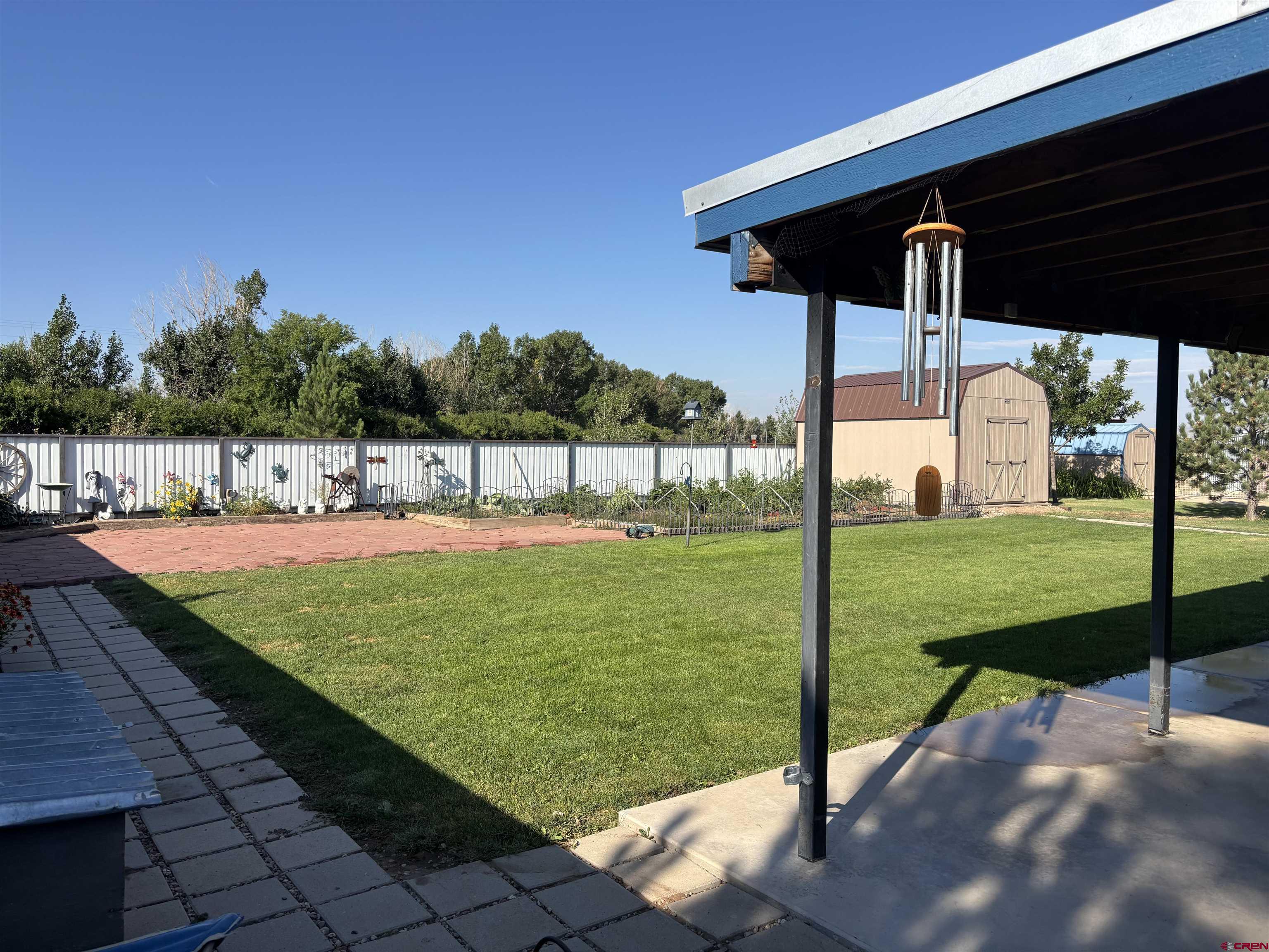 9227 County Rd C Jaroso, CO 81138 - Photo 23 of 28 a view of a backyard with table and chairs
