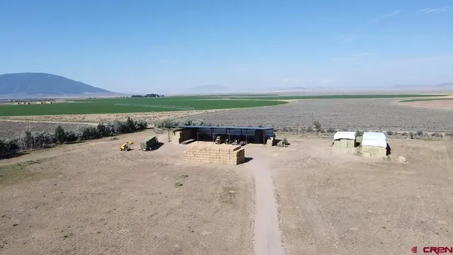 a view of house with a yard