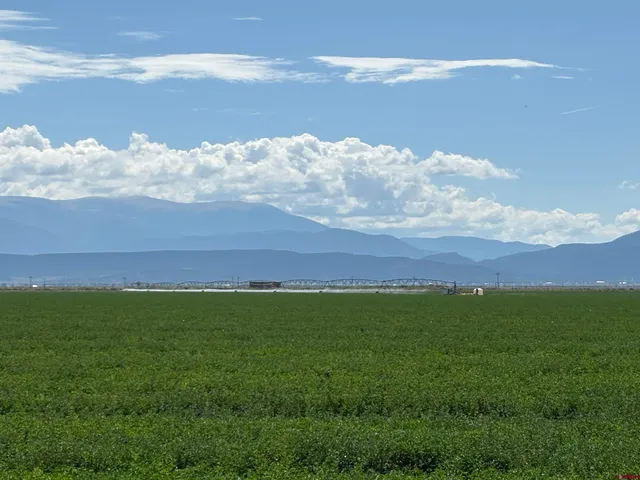 a view of lake with green space