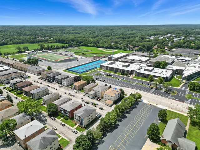 an aerial view of residential houses with outdoor space