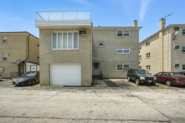 a front view of a house with parking space