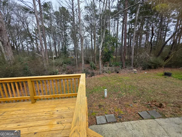a view of swimming pool with seating space