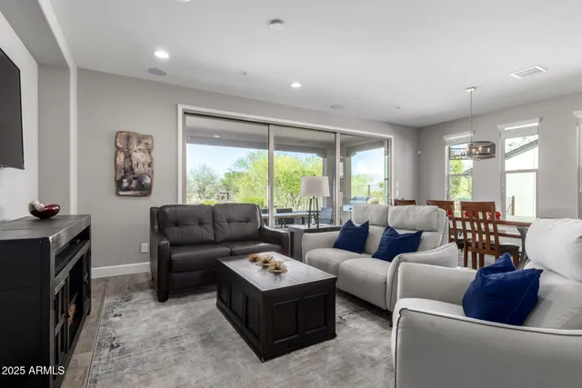 a view of a livingroom with furniture and windows
