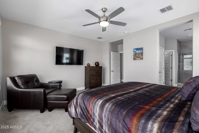 a bedroom with a bed and a couch