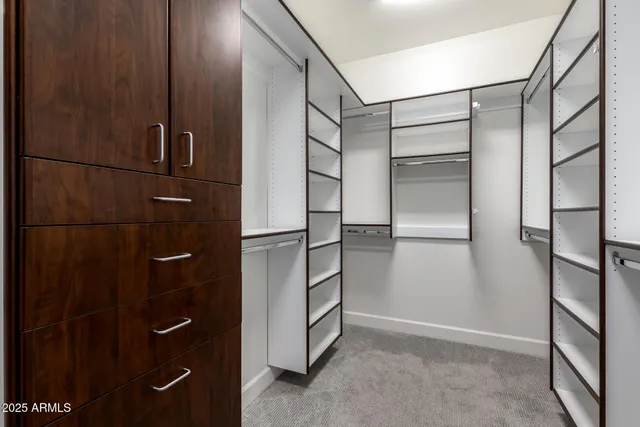 a bedroom with a bed dresser and a window