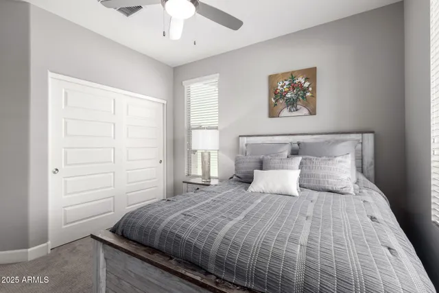 a bed room with a bed and a window