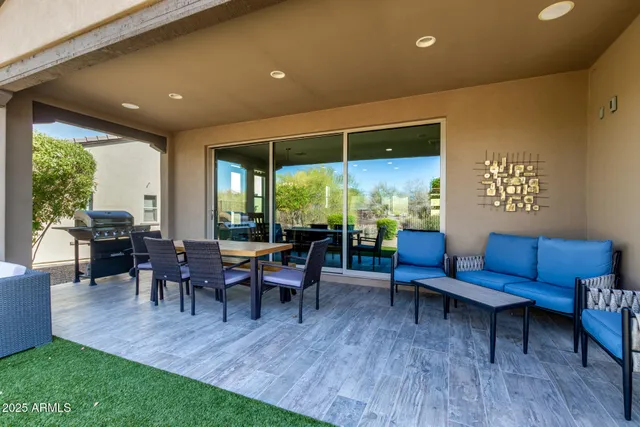 a view of a livingroom with a ceiling fan and window