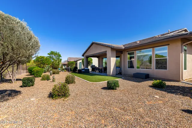a view of swimming pool with outdoor seating and plants